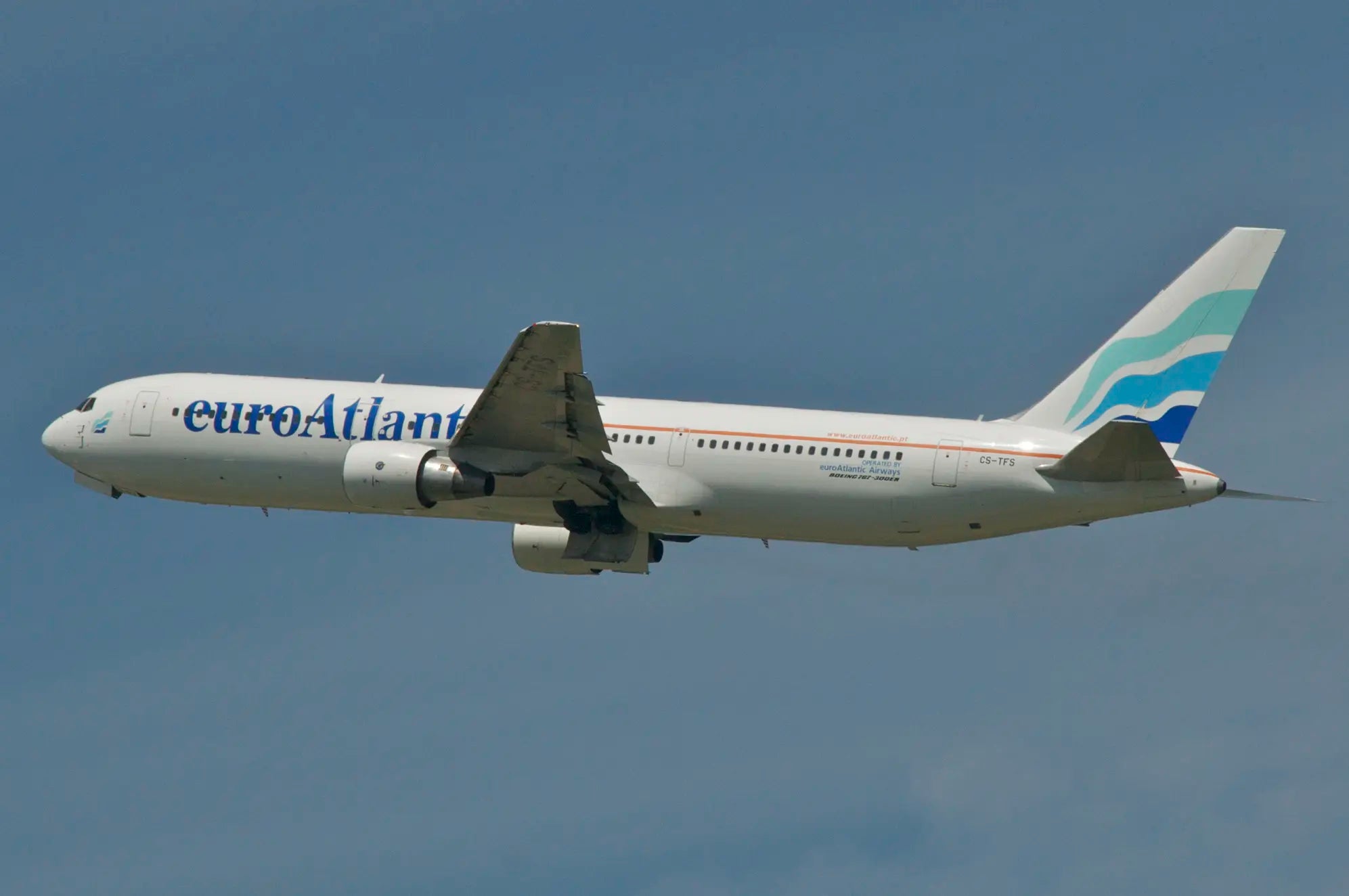 Euro Atlantic Airways Boeing 767-300 aircraft, registration CS-TFS, in flight against a clear blue sky.