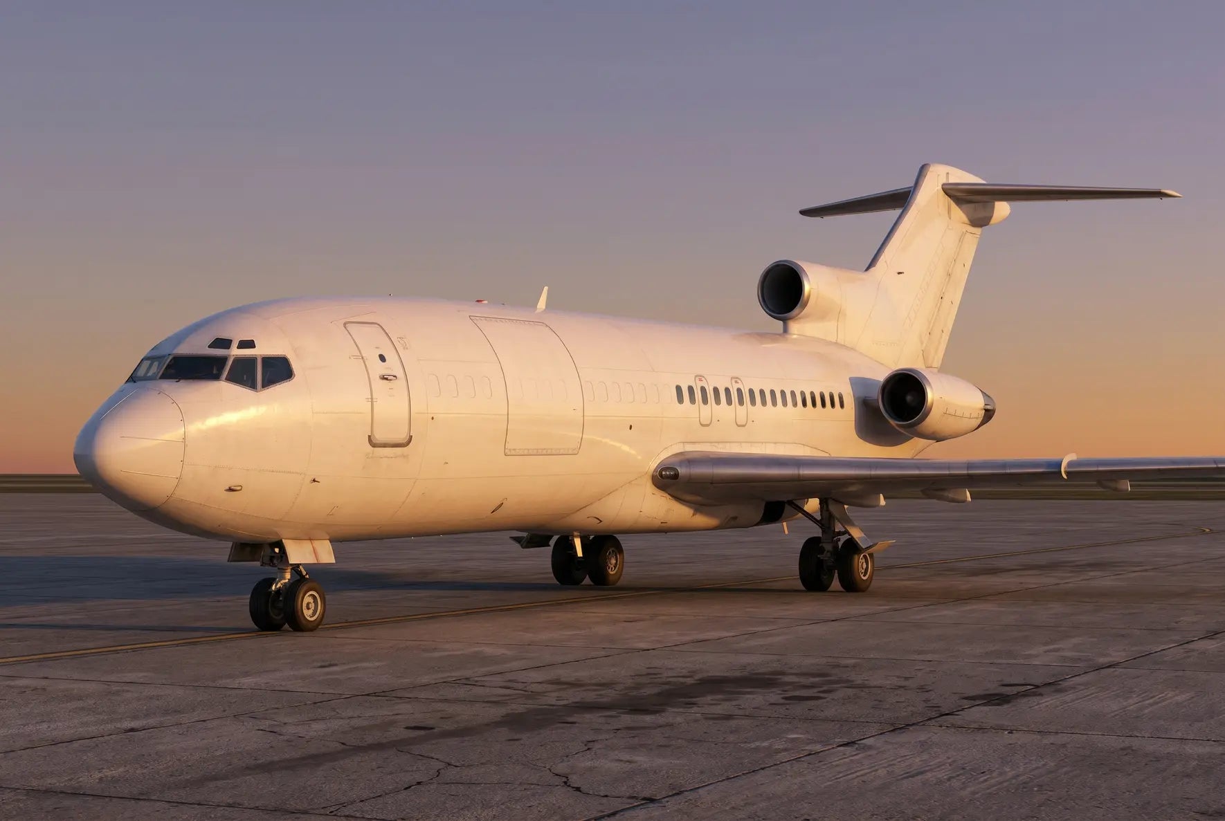 A Boeing 727-100C aircraft on the tarmac at sunset, with a clear view of its three engines and distinctive T-tail design.