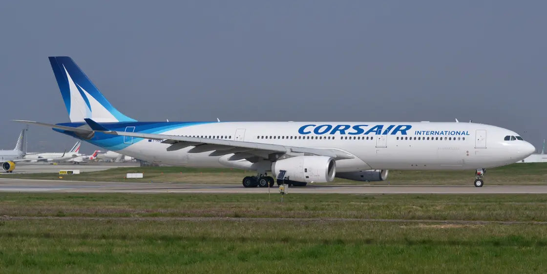 Airbus A330-300 airplane operated by Corsair International on a runway, displaying the airline's logo and blue tail fin livery.