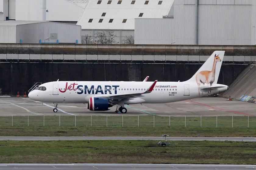 JetSMART Airbus A320-271N aircraft on the tarmac at Toulouse airport, featuring a wildlife image on the tail and white livery with JetSMART branding.