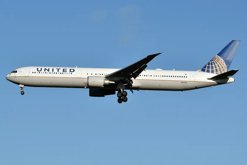 United Airlines Boeing 767-424 ER aircraft with registration N69063 in flight against a clear blue sky.